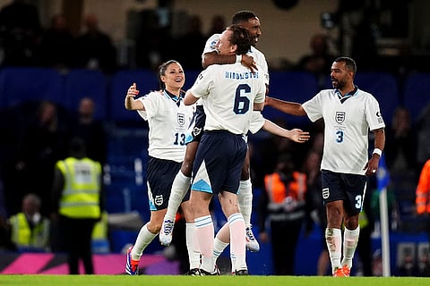 England's players celebrate their victory against World XI